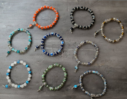 Evil Eye 8mm Beaded bracelet on elastic cord -Assorted colors/styles w/ charm