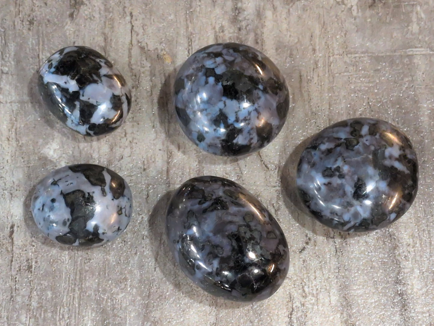 Merlinite palm stone Priced Each